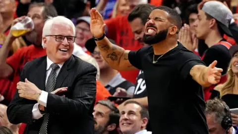 USA Today Sports Drake reacts courtside