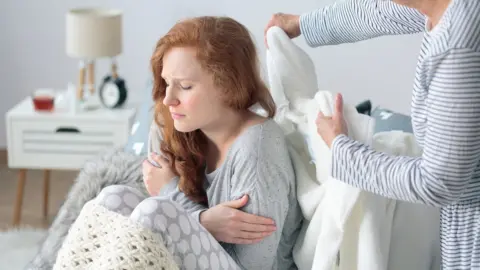 Getty Images Sick woman