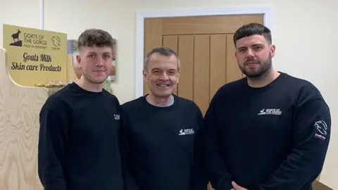 Family photo Three men smiling at the camera