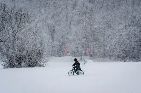 Anthony Morris Cycling through the snow at South Park