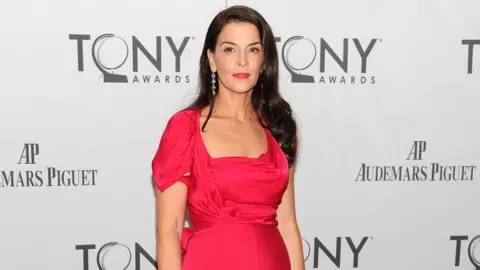 Getty Images Annabella Sciorra poses on the Tony Awards red carpet