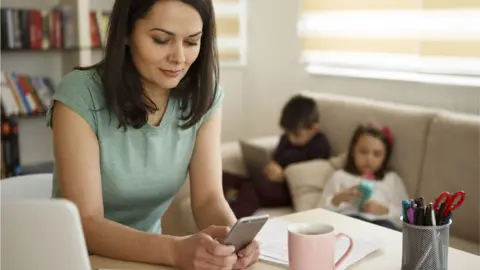 Getty Images Children's relationships with parents were said to be damaged by spending too much time on mobile phones