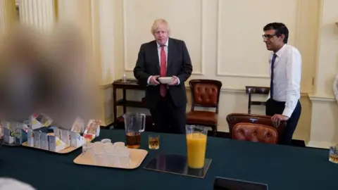 Cabinet Office/PA Media Rishi Sunak attending a gathering in the Cabinet Room at No 10 to mark Boris Johnson's birthday