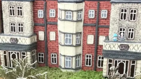 Tricia Wilson A knitted Prince Phillip and Queen Elizabeth II on a balcony at Sandringham