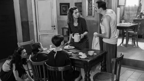 Fremantle A scene with Delia and family at dinner, with her husband looking confrontational