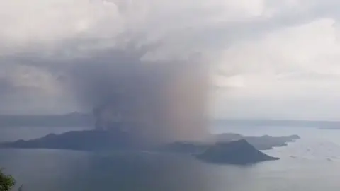 Jon Patrick Laurence Yen via Reuters A view of the Taal volcano eruption seen from Tagaytay, Philippines, 12 January, 2020 in a still image taken from a social media video.