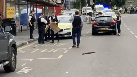 BBC Police at scene of stabbing in Woolwich