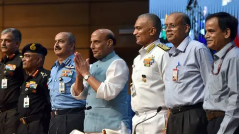 Getty Images Minister of Defence of India Rajnath Singh, Indian air force Chief Air Chief Marshal Vivek Ram Chaudhari, Indian Army Chief General Manoj Pande, Indian navy chief Admiral R. Hari Kumar, defence secretary of India Ajay Kumar, address a Press Conference announcing Agnipath Scheme at National Media Centre on June 14, 2022 in New Delhi, India.
