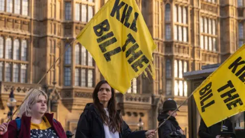 Getty Images Campaigners protest against the Public Order Bill outside the House of Lords