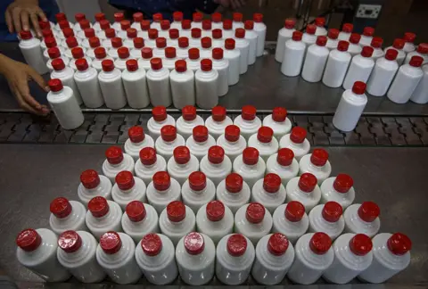 AFP/Getty Images A Chinese worker arranges bottles of quality locally made wine called baijiu at the Guizhou Huaizhuang Liquor Group on 22 September 2016 in Maotai,Guizhou province, China
