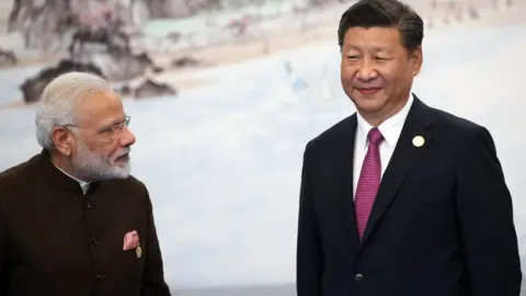 Getty Images Indian Prime Minister Narendra Modi (L) with Chinese President Xi Jinping (R) prior to the dinner on September 4, 2017 in Xiamen, China.