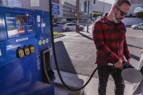 Getty Images Man filling tank in California