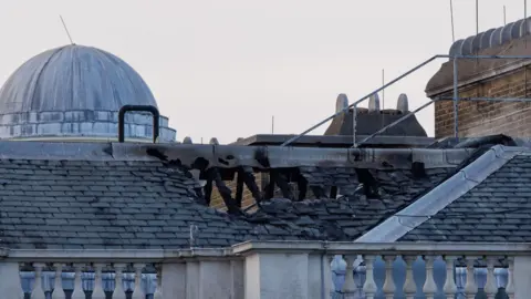 EPA The burnt out roof of Somerset House