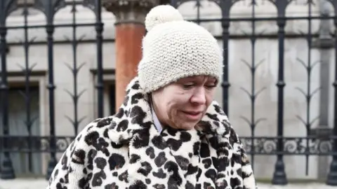 Kirsty O"Connor/PA Wire Tina Malone leaves the High Court in London where she avoided jail