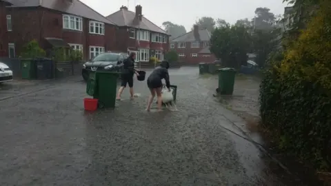 Jessica Tickell People clearing drains in Loughborough