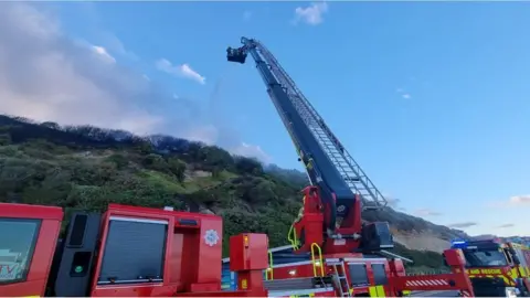 Dorset&Wiltshire Fire and Rescue Fire engine at near the clifftop