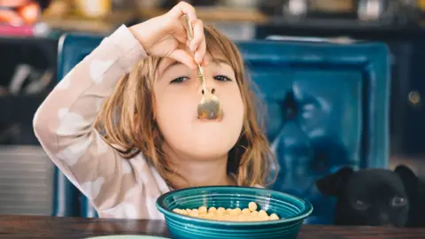Getty Images A girl eating cereal