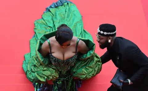 Antonin Thuillier/ AFP Nigerian actress Chika Ike arrives for the opening ceremony and the screening of the film "Jeanne du Barry" during the 76th edition of the Cannes Film Festival in Cannes, southern France, on May 16, 2023.