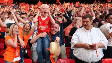 Getty Images Luton Town fans celebrate promotion