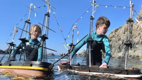 Ollie and Harry Ferguson with boats