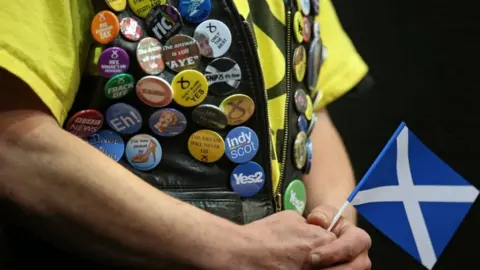 PA SNP supporter with badges