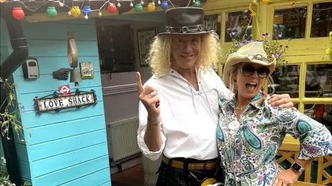 Steve Cassini Steve Cassini and his wife Sheba outside their home on Eel Pie Island