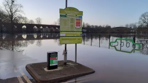 Worcester City Council The car park sign and floodwater all around it