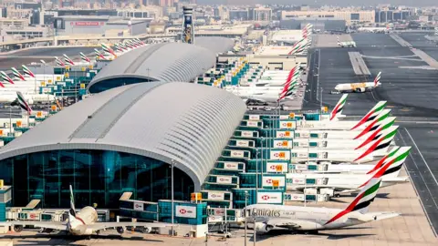 AFP Lots of Emirates planes parked at a Dubai airport terminal