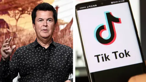 Getty Images Simon Fuller and the TikTok app, displayed on a smart phone