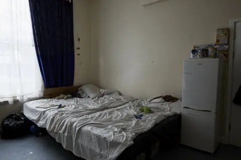 Katie Wilson The bedroom of Sainey and her children