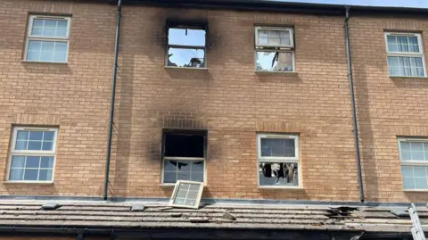 Derbyshire Fire and Rescue Service Smashed windows at the home and damaged to the roof. 