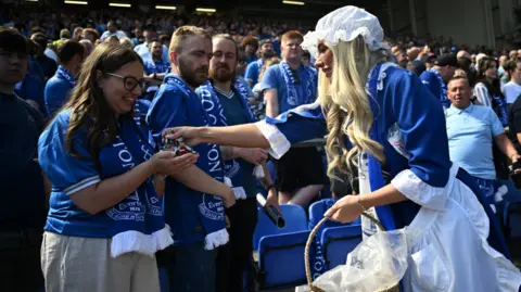 Reuters The Everton toffee lady handed out sweets