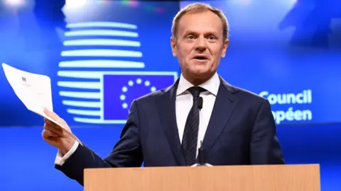 Getty Images European Council President Donald Tusk holds British Prime Minister Theresa May's formal notice of the UK's intention to leave the bloc under Article 50 of the EU's Lisbon Treaty that was delivered to him by Britain's ambassador to the EU, during a press conference in Brussels on March 29, 201