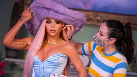 PA Media Artist paints Jesy figure