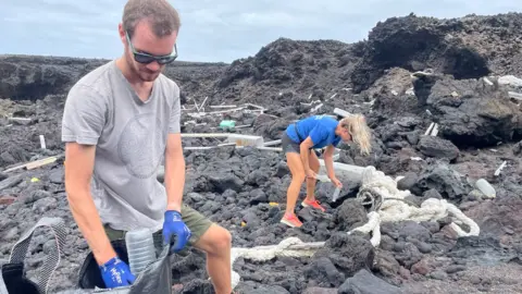 ZSL, Alice Chamberlain two conservationists helping to clean the coast.