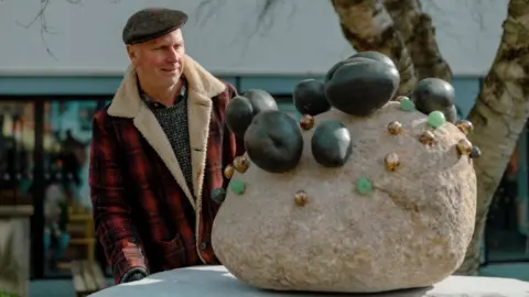 Arts University Plymouth Kurt Jackson with his sculpture in Plymouth