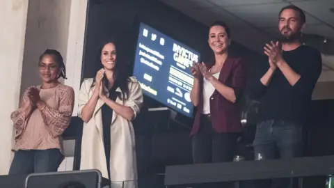 PA Meghan Markle with her mother, stylist and Markus Anderson