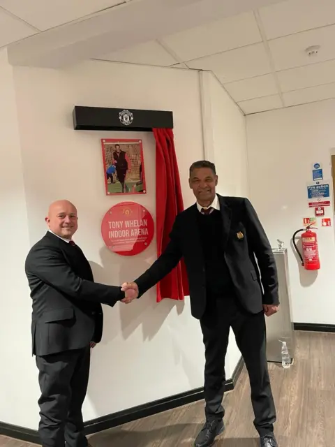 Tony Whelan Tony Whelan shaking hands 
