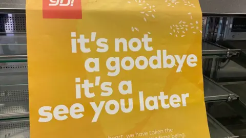 Sign at closed restaurant saying it's not a goodbye it's a see you later