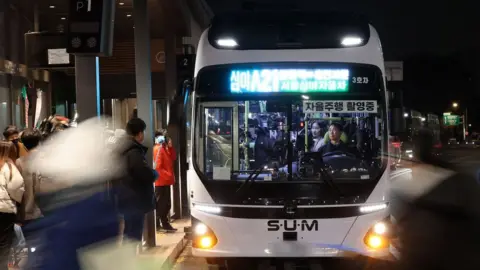 News1 The A21 self-driving bus on a street in Seoul, South Korea.