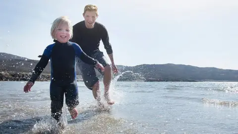 Getty Images Playing on a beach