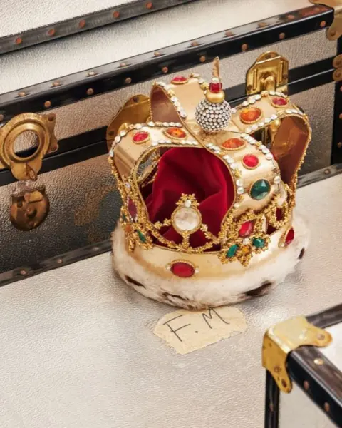 Sotheby's  Freddie Mercury's fake fur, red velvet and rhinestones crown