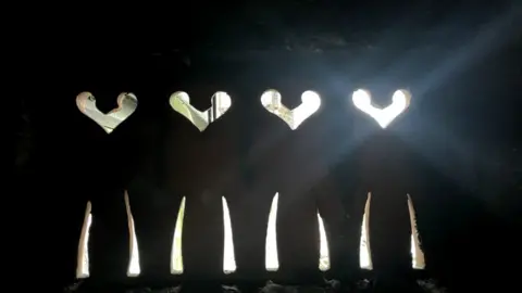 Andrew Turner/BBC Heart and brick details in the old Palmers building