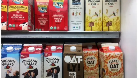 Getty Images A grocery shelf of milks and milk alternatives