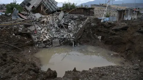 Getty Images A view shows aftermath of recent shelling during the ongoing fighting between Armenia and Azerbaijan over the breakaway Nagorno-Karabakh region, in the disputed region's main city of Stepanakert