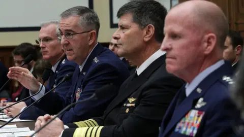 Getty Images Gen John Hyten and other military figures address a Congressional hearing in March 2017.