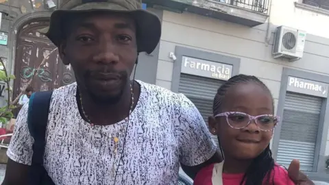 Yaya Sangare with his four-year-old daughter, Deborah