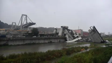 EPA Wide shot shows large section of bridge collapsed, with remaining part exposed