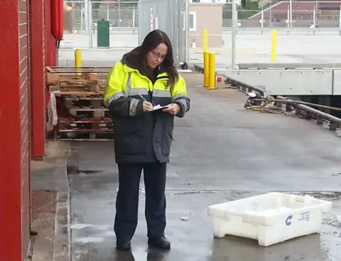 DeeAnn works as a fisheries officer checking the operation of the industry