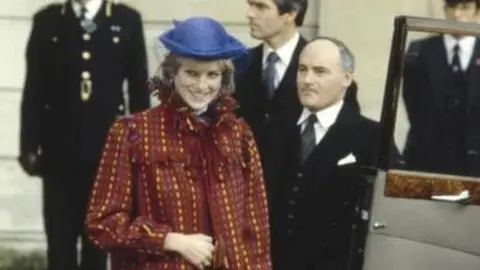 Princess Diana wearing a red coat by Bellville Sassoon at the Guildhall, 1981.